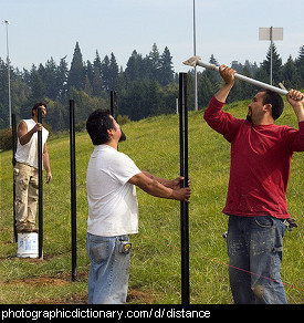 Photo of men building a fence