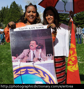 Eritreans holding the flag of Eritrea.