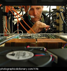 Photo of someone fixing a computer