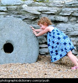 Photo of a girl pushing