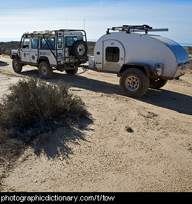 Photo of a car towing a trailer